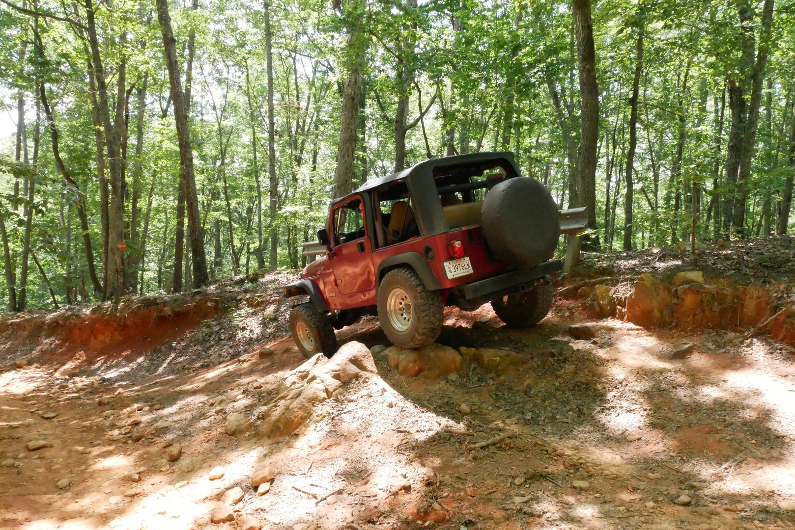 Jeep navigating challenging rock formations