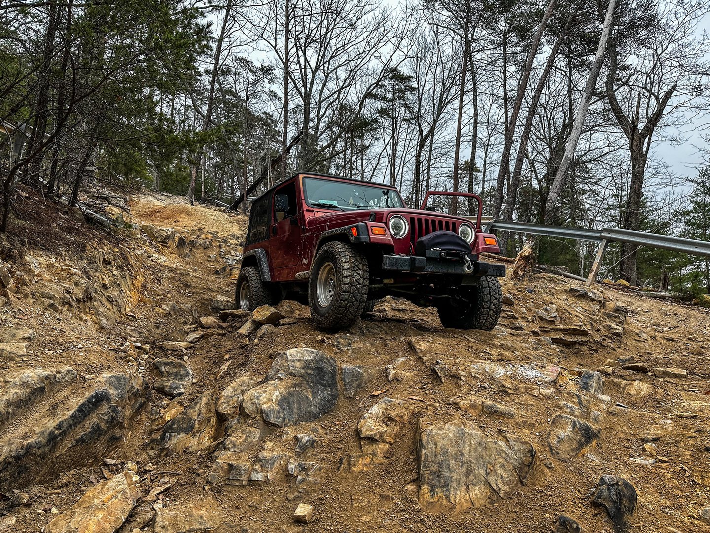Jeep positioned at scenic mountain overlook